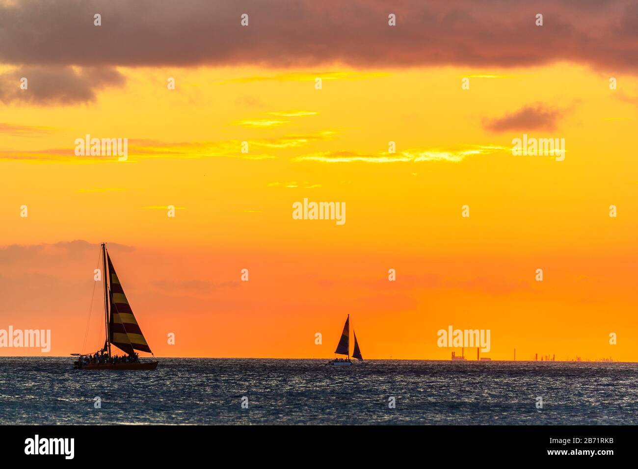 United States of America, Hawaii, Oahu island, sailing boat at sunset Stock Photo