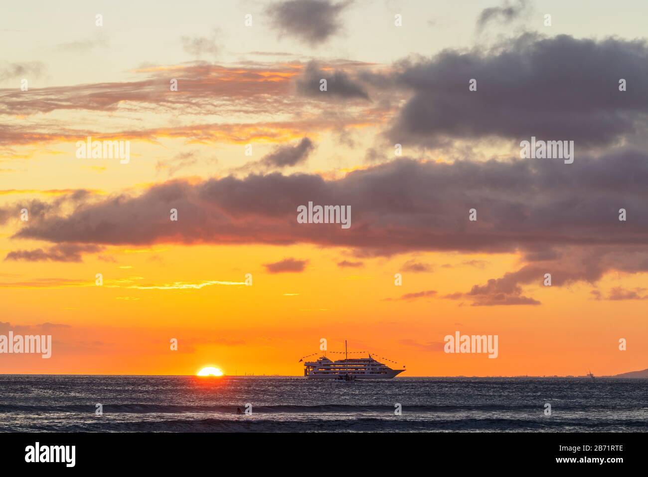 United States of America, Hawaii, Oahu island, cruise ship at sunset Stock Photo
