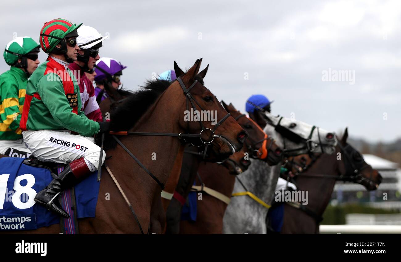 Runners and riders wait to start the Pertemps Network Final Handicap Hurdle during day three of the Cheltenham Festival at Cheltenham Racecourse. Stock Photo