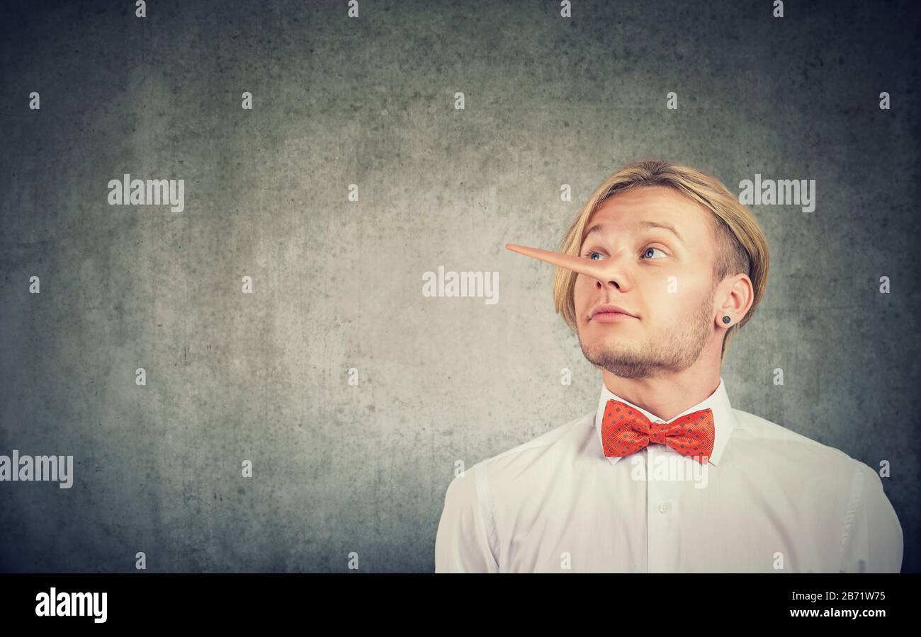 A liar funny looking man with long nose Stock Photo - Alamy