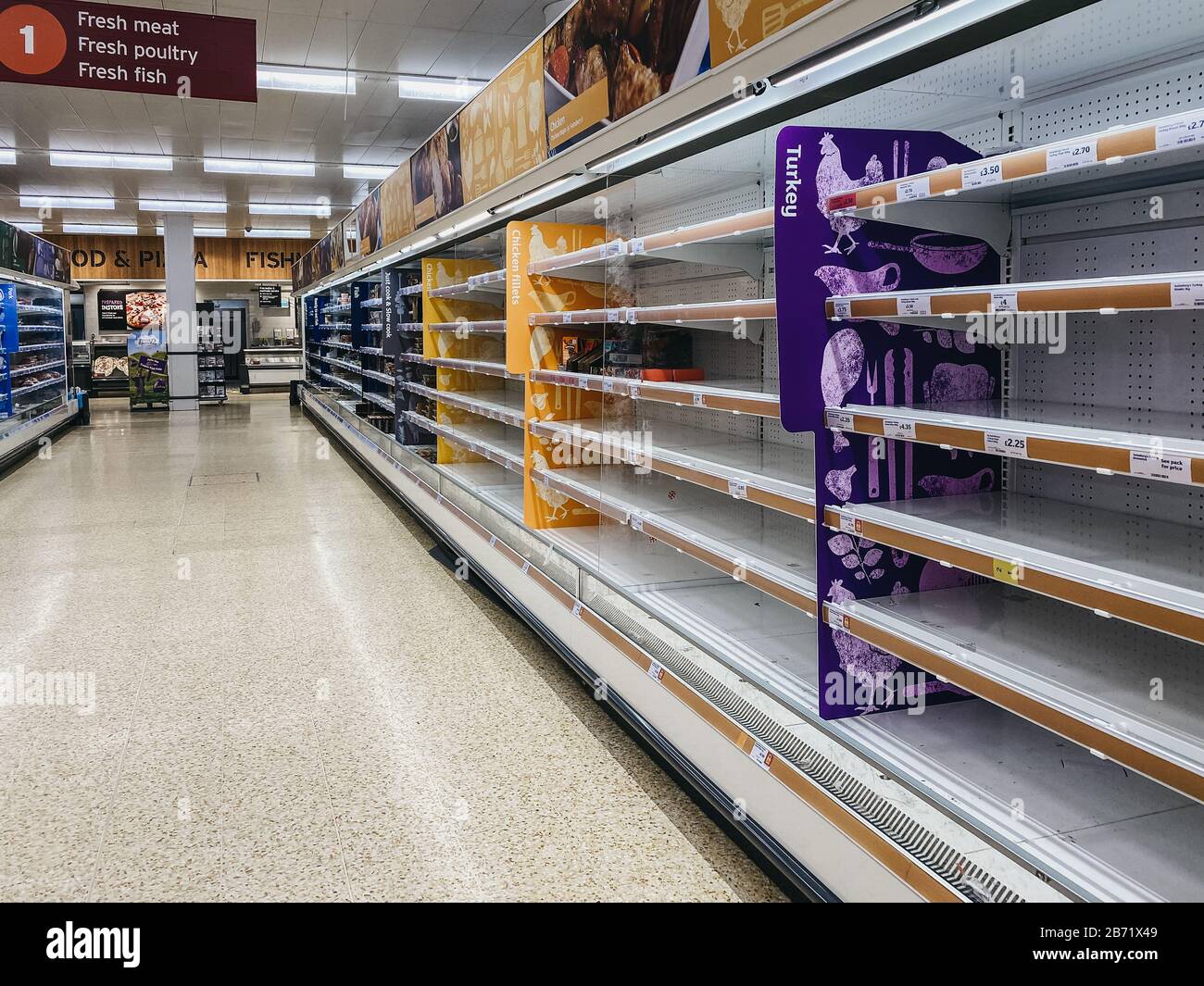 Empty shelves in meat aisle of Sainsburys supermarket in Winchmore Hill, London, as people stock up due to Coronavirus threat. Stock Photo