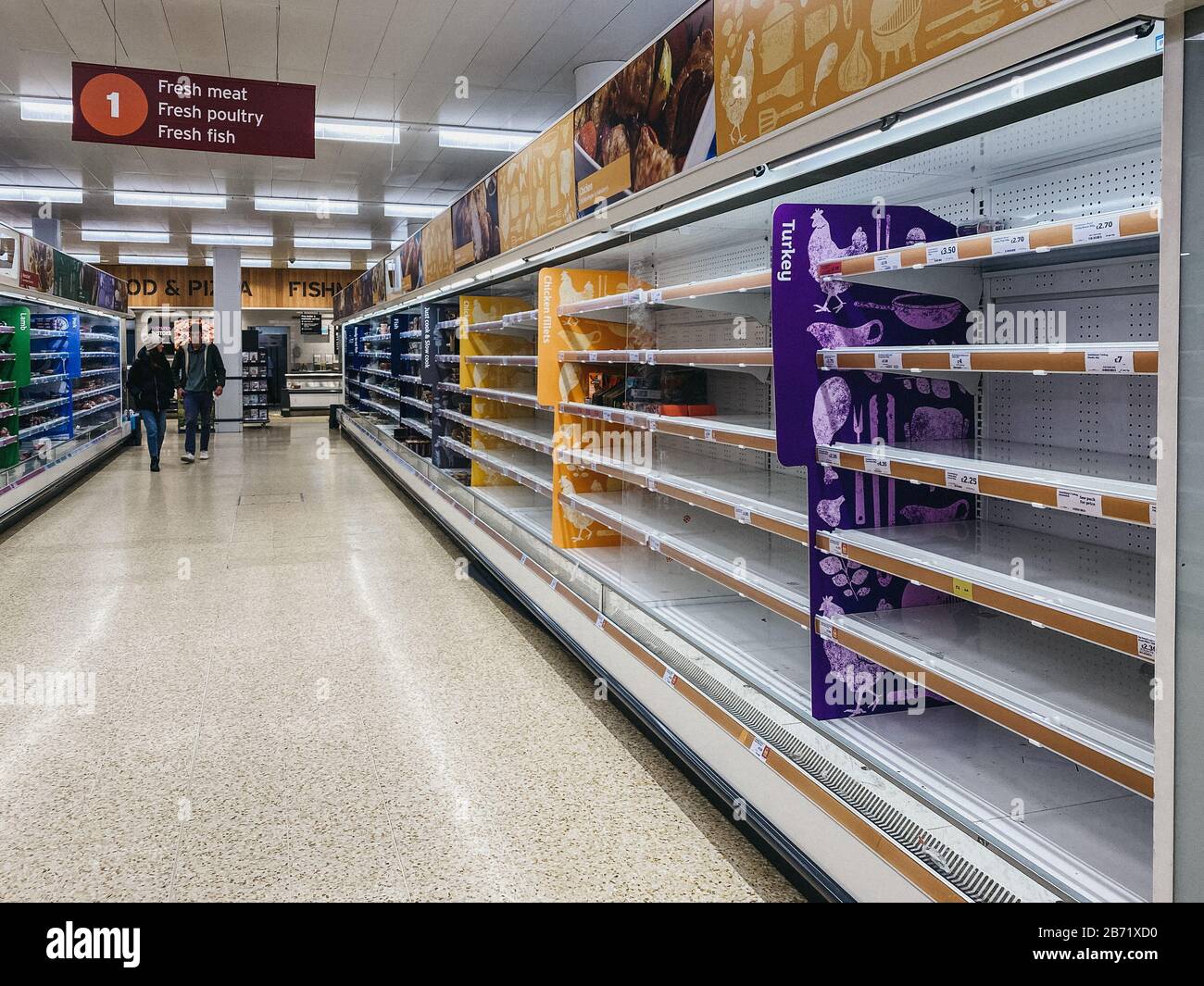 Empty shelves in meat aisle of Sainsburys supermarket in Winchmore Hill, London, as people stock up due to Coronavirus threat. Stock Photo