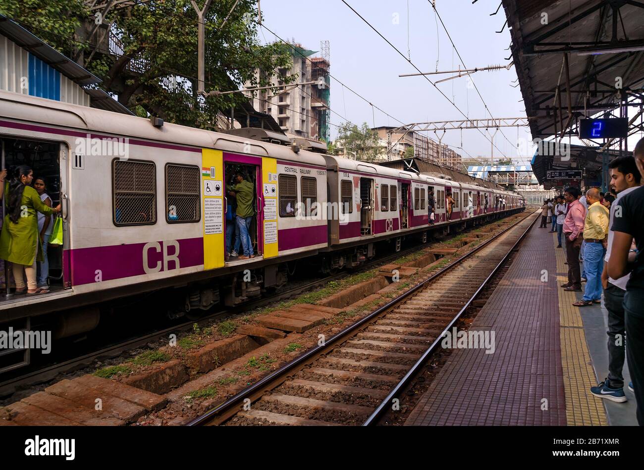 MUMBAI, INDIA – DEC. 19, 2019 : Mumbai Suburban Railway Train, one of the busiest and always overcrowded commuter rail systems in the world. Stock Photo