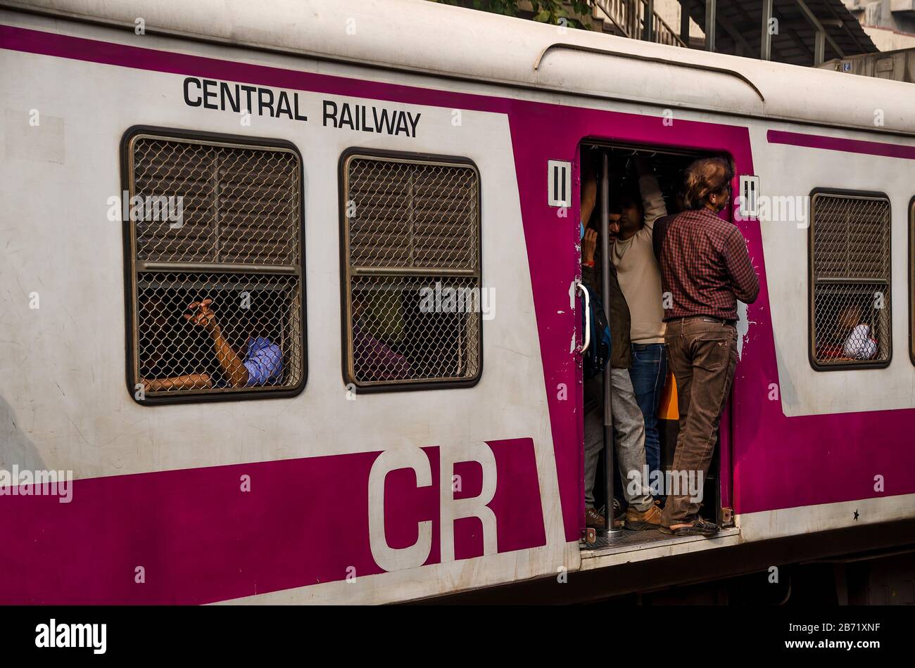 MUMBAI, INDIA – DEC. 19, 2019 : Mumbai Suburban Railway Train, one of the busiest and always overcrowded commuter rail systems in the world. Stock Photo