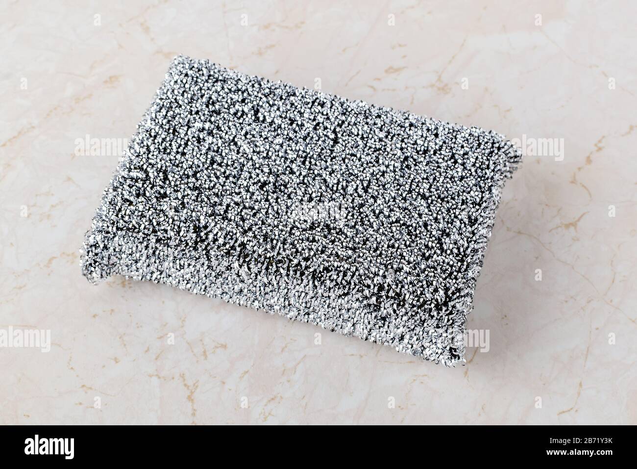 https://c8.alamy.com/comp/2B71Y3K/metallized-fiber-foam-sponge-for-dishes-and-housework-new-silver-foam-sponge-for-dishwashing-on-a-kithen-table-purity-and-household-chores-2B71Y3K.jpg