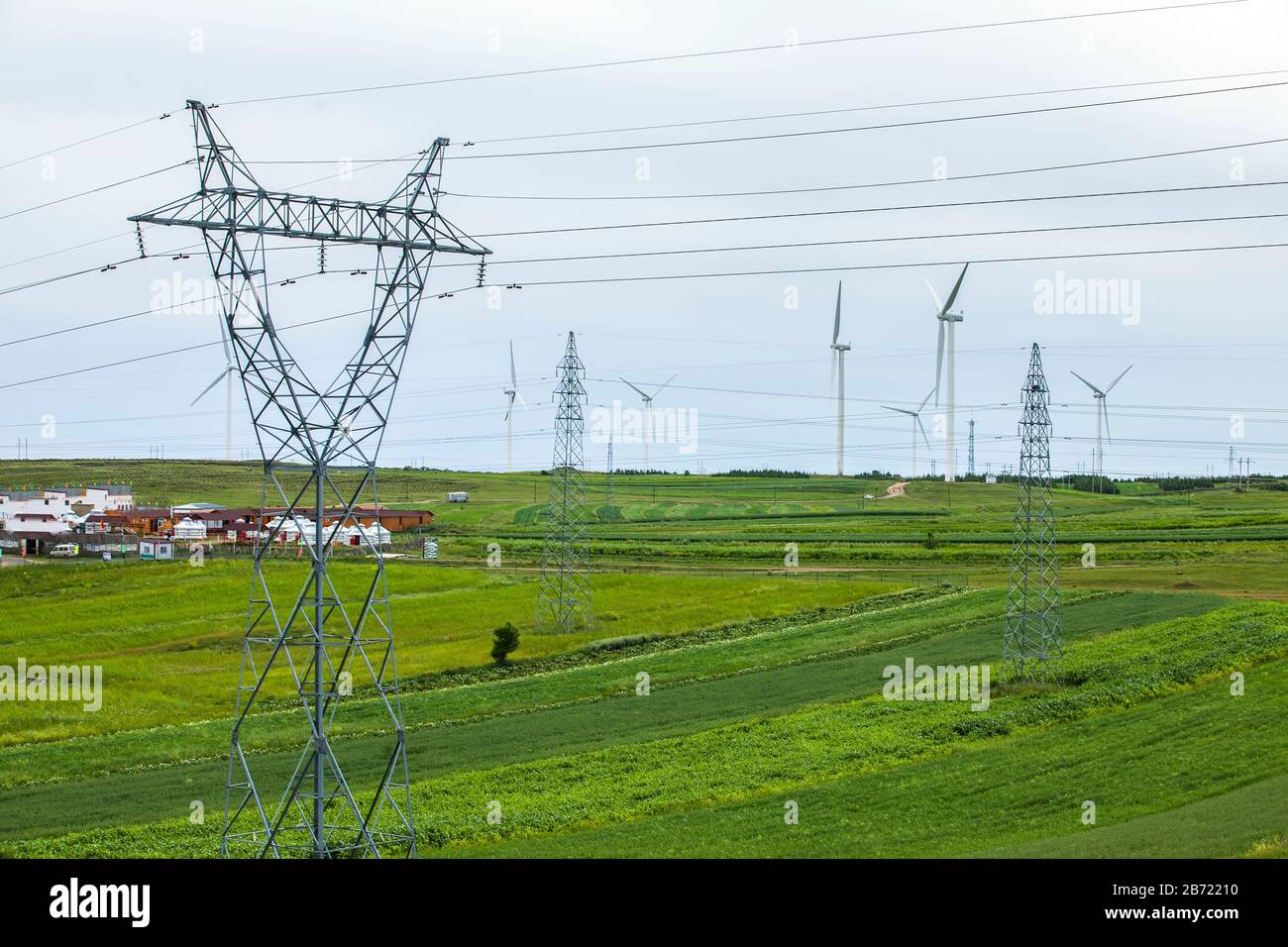 High voltage towers, under the blue sky white clouds Stock Photo - Alamy