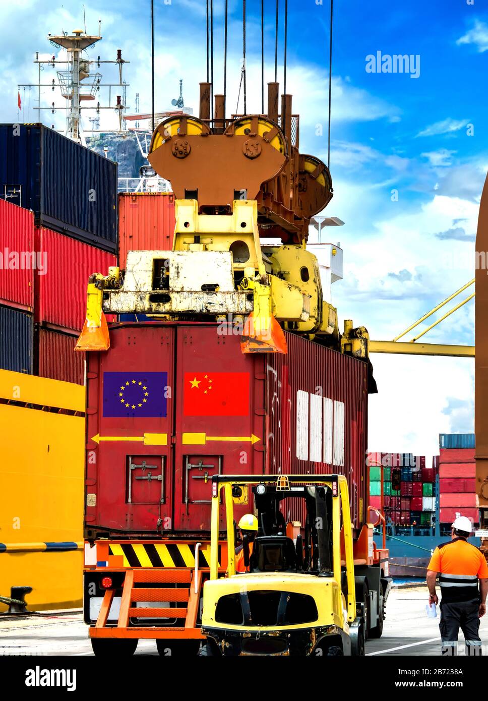 Container crane handling container box loading to truck in import