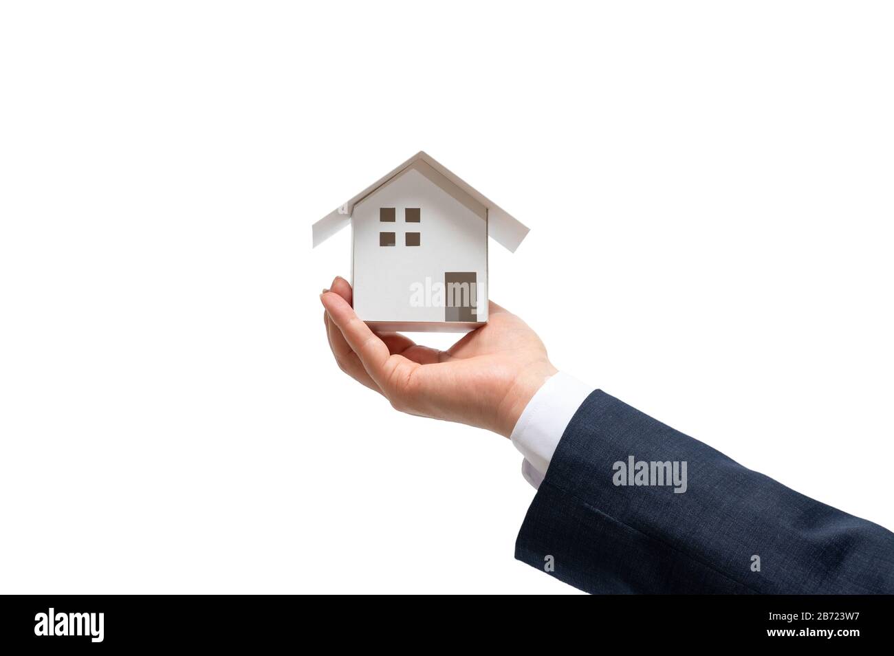 Businessman with house model on hand. Real estate concept Stock Photo ...