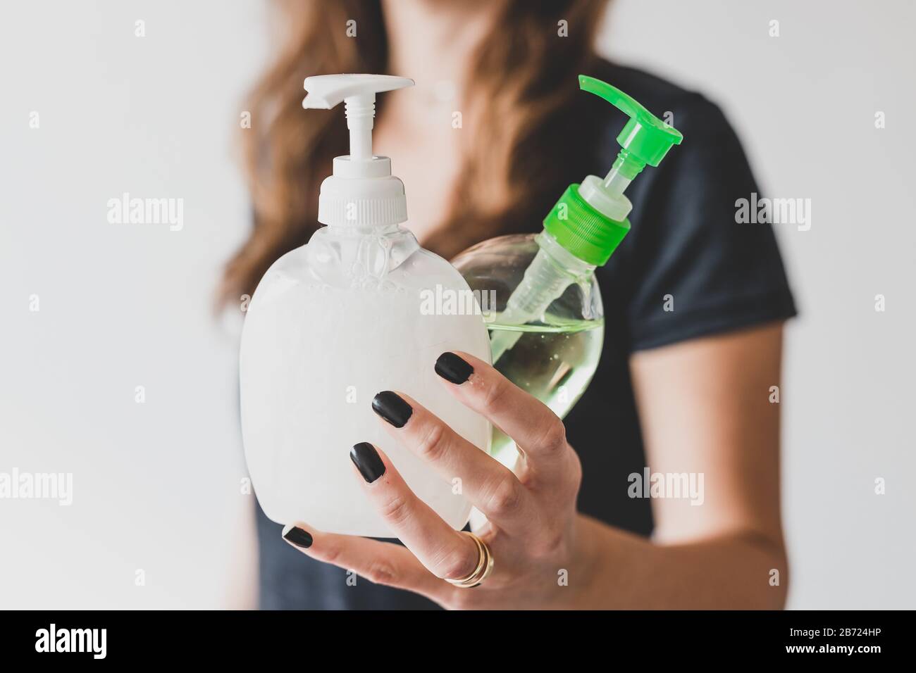 hygiene and protecting from viruses and bacteria, woman holding bottle