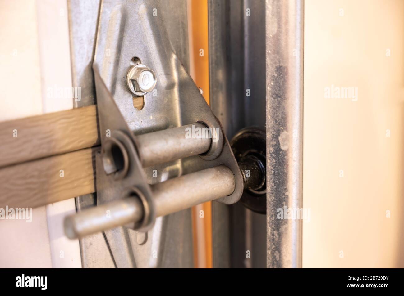 Garage door metal panel hinge Stock Photo Alamy