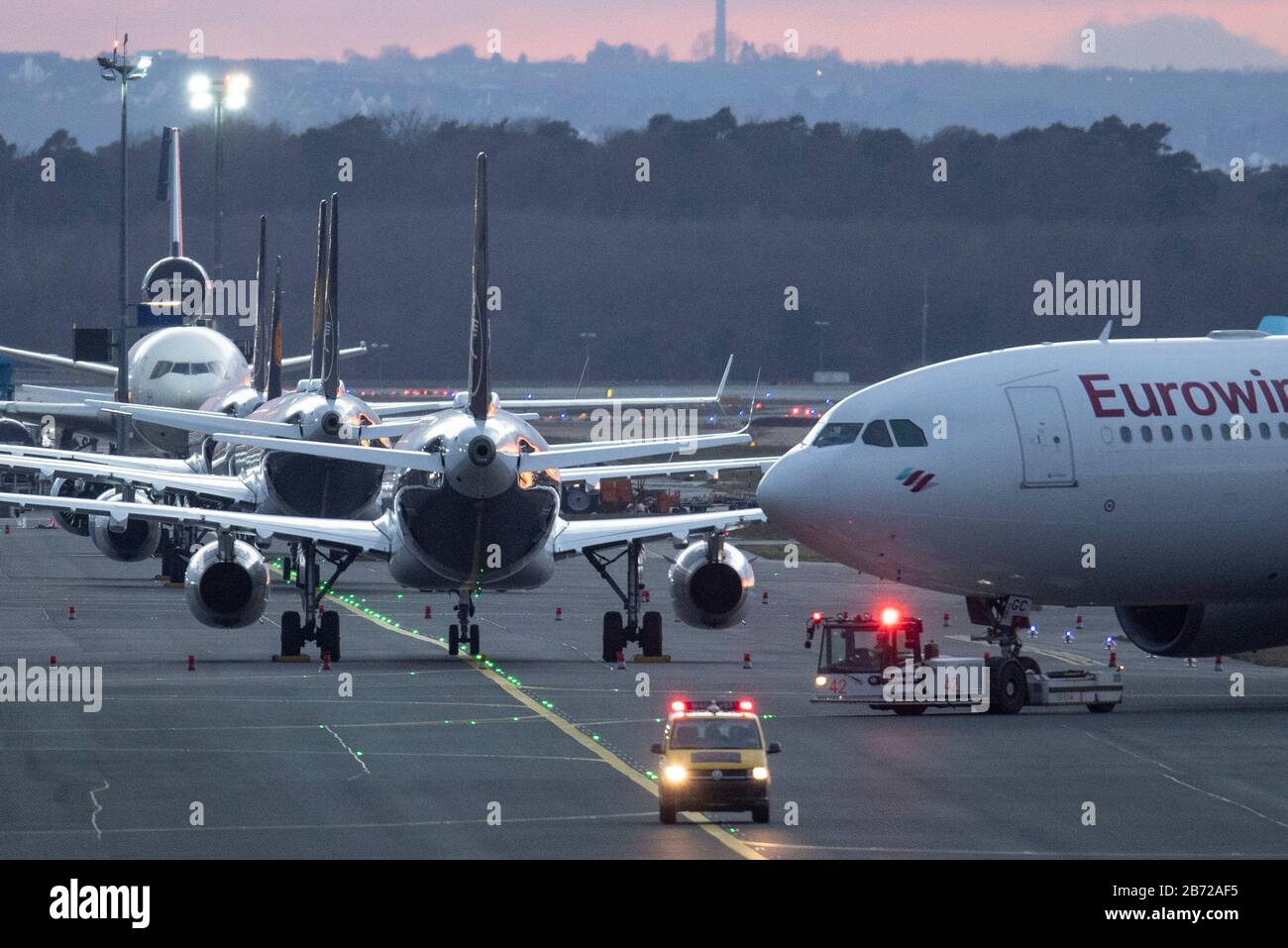 12 March 2020, Hessen, Frankfurt/Main: A passenger plane on the tarmac of Frankfurt airport. As of Saturday, Europeans are banned from entering the USA. The aviation industry is also affected by the travel restrictions resulting from the corona pandemic. Photo: Boris Roessler/dpa Stock Photo