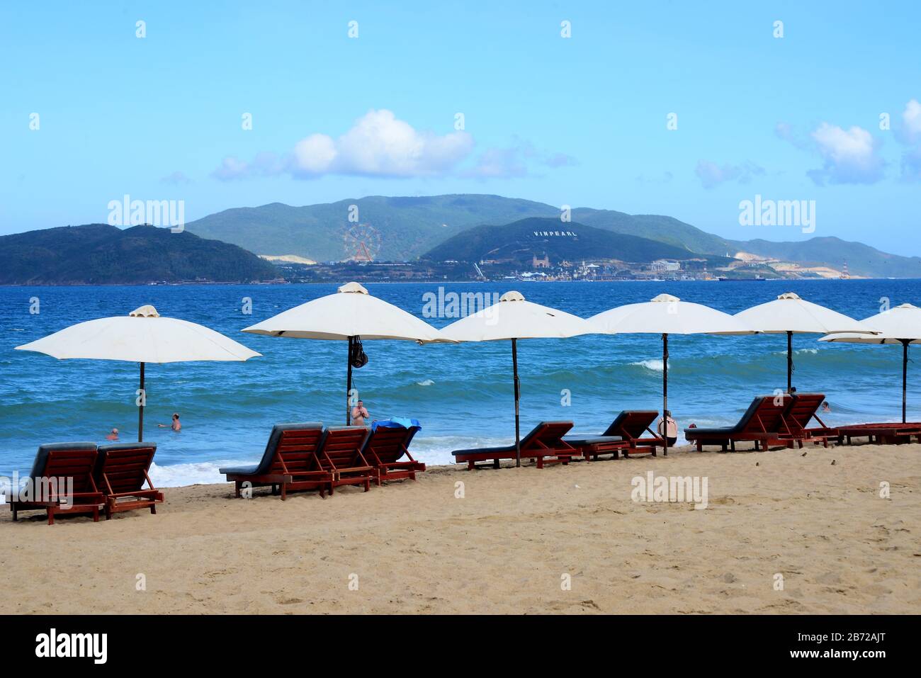 NHA TRANG, VIETNAM – 29 FEBRUARY 2020 : nha trang beach behind is an Vinpearl Land Stock Photo