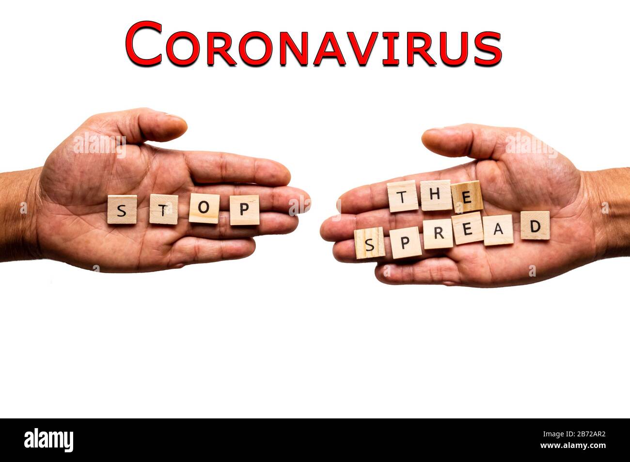 Coronavirus. Two hands display the message 'STOP THE SPREAD'. Stock Photo