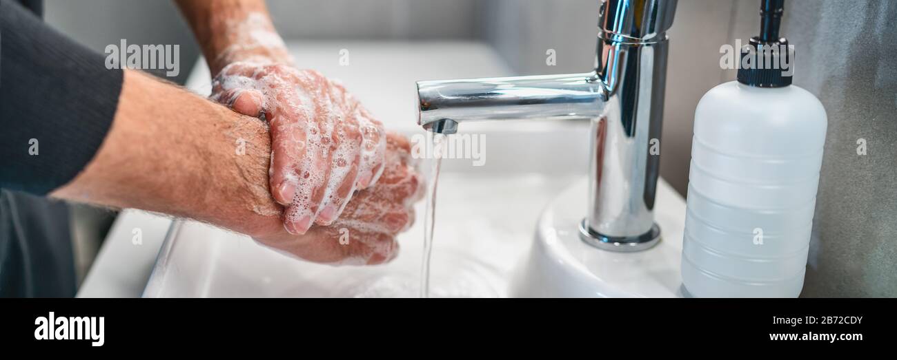 Corona virus travel prevention wash hands with soap and hot water. Hand hygiene for coronavirus outbreak. Protection by washing hands frequently concept panoramic banner header. Stock Photo