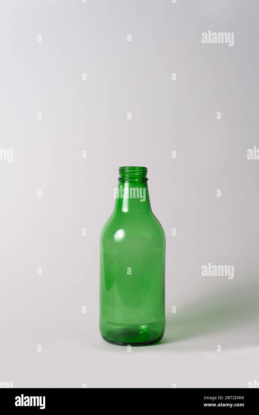 Download Small Empty Green Glass Bottle Without Cover And Label On Bright Grey Background Can Be Used As Mock Up For Juice Or Beer Stock Photo Alamy