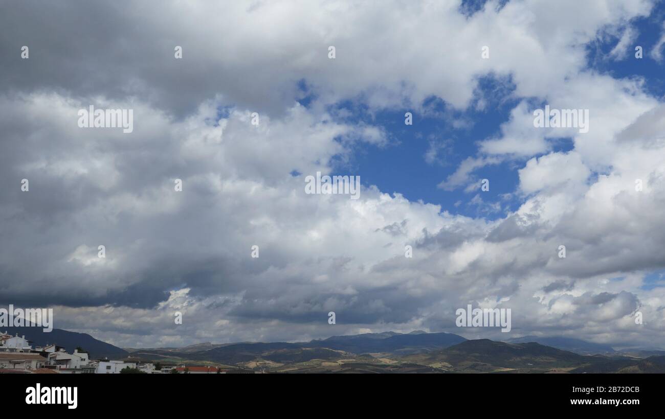 Patch of blue sky over village and valley in Andalusia Stock Photo