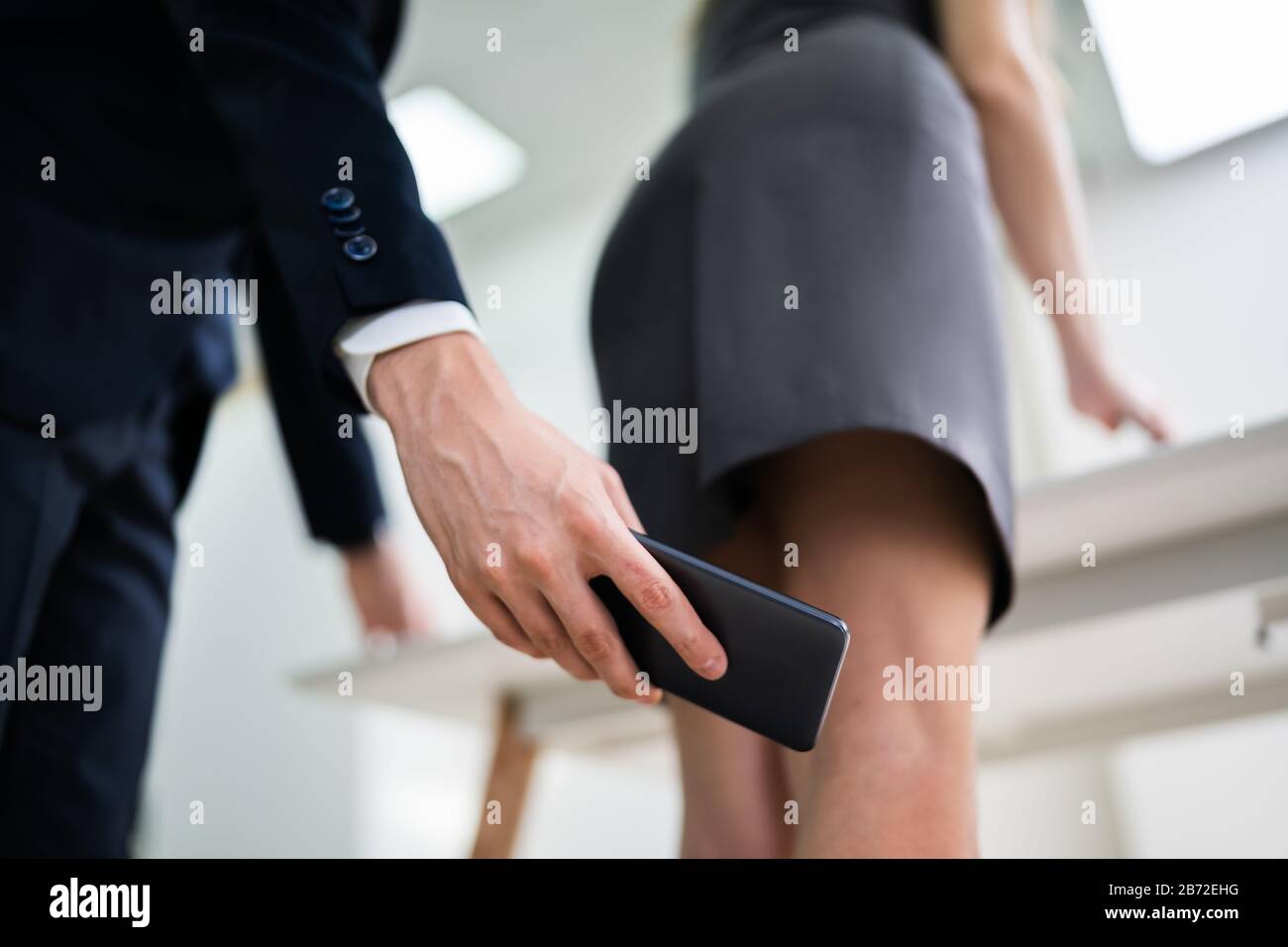 #13 of office upskirt Man Taking Upskirt Photo Of Woman In Office Stock Photo - Alamy office upskirt Man Taking Upskirt Photo Of Woman In Office Stock Photo - Alamy