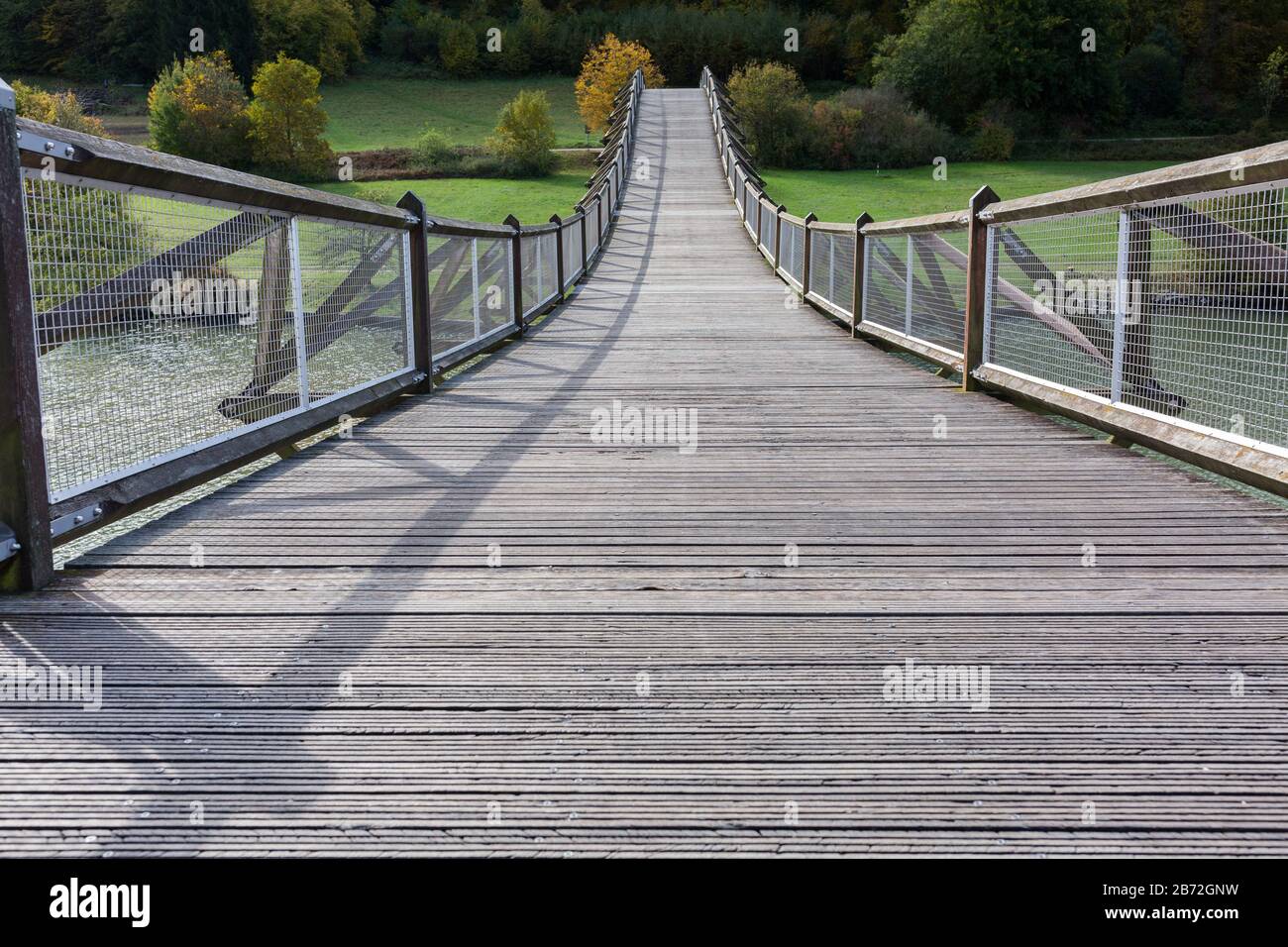 View on Tatzelwurm Brücke (bridge). Due to is curved architecture a tourist spot. Located in the Altmühltal. Wooden construction. Stock Photo