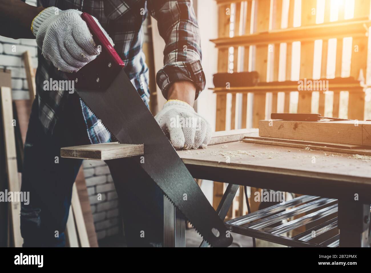 Carpenter Working On Wood Craft At Workshop To Produce Construction Material Or Wooden Furniture The Young Asian Carpenter Use Professional Tools For Stock Photo Alamy