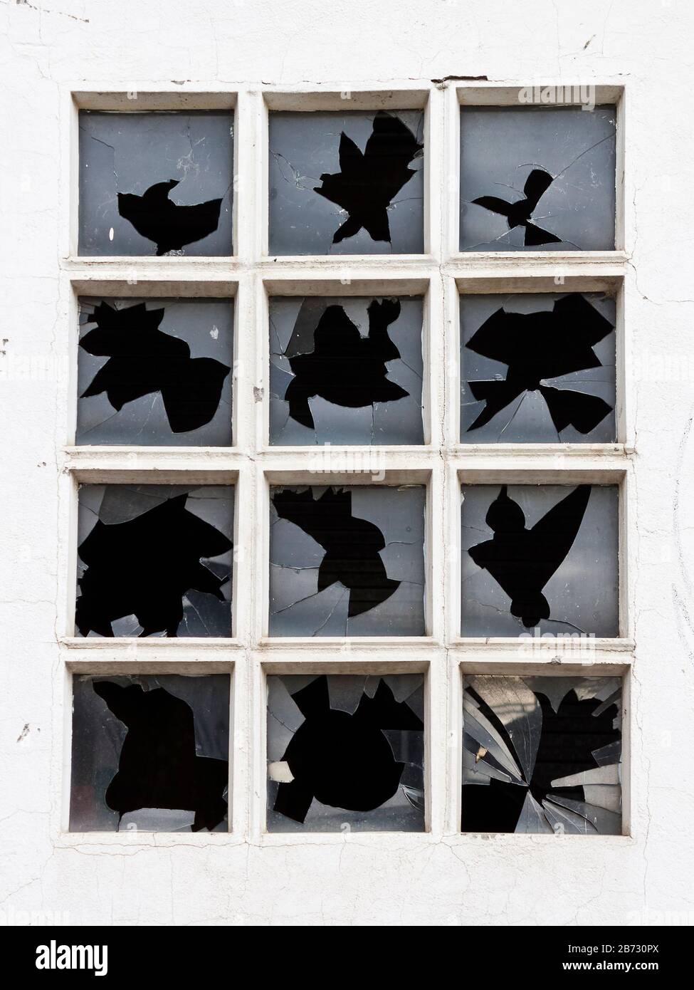 Broken window glasses in an industrial building. Stock Photo