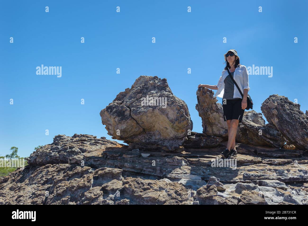 Two female hikers at Cobbold Gorge in Queensland take a moment to admire the beauty of the landscape. Stock Photo