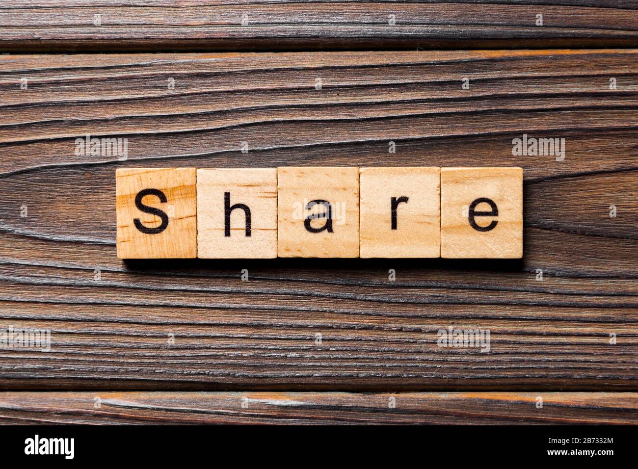 share word written on wood block. share text on table, concept. Stock Photo