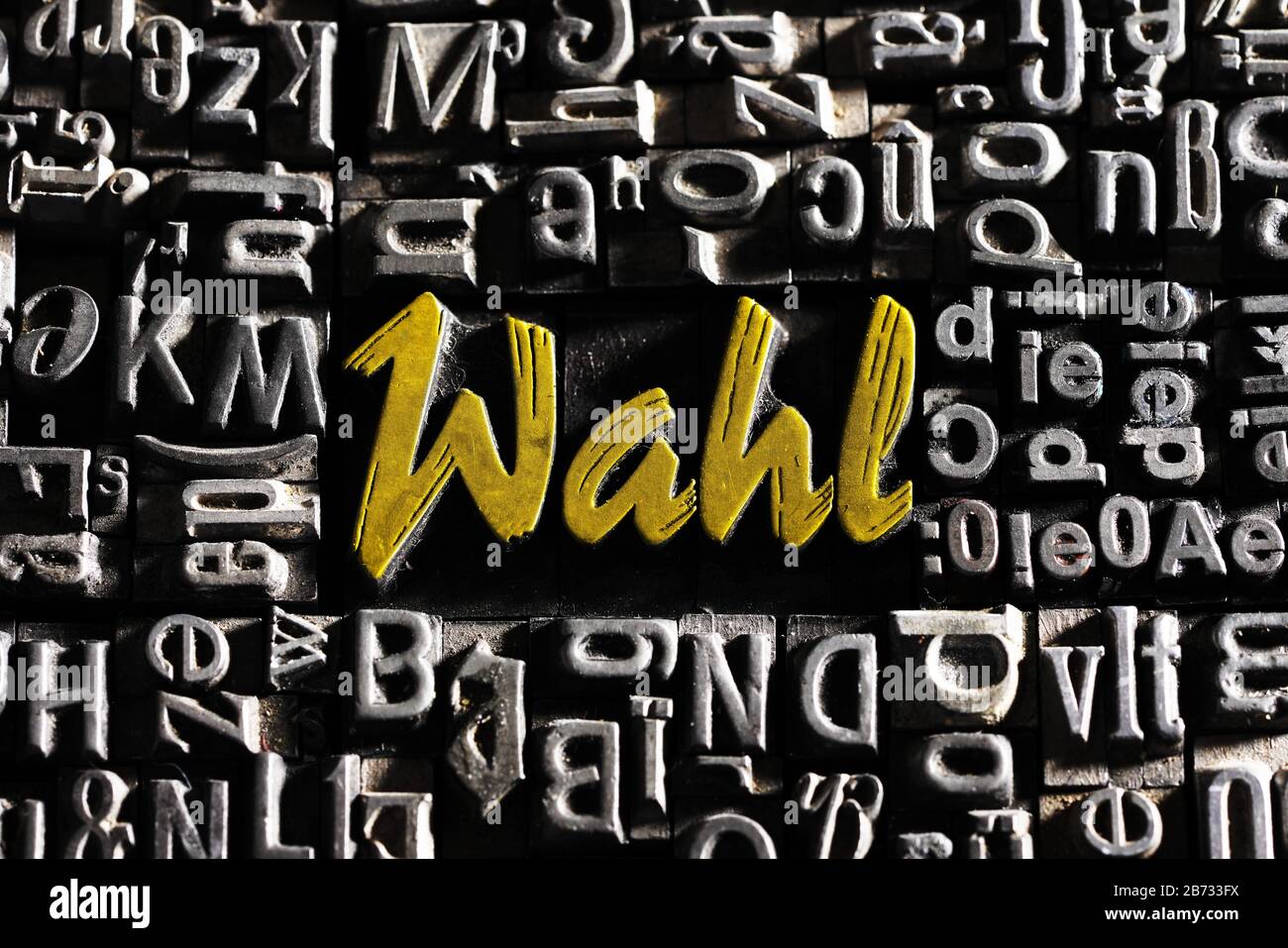 Old lead letters with golden writing show the word Wahl, Germany Stock Photo