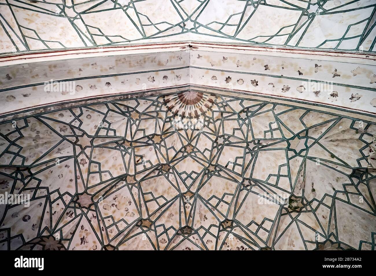 Geometric decoration of Islamic architecture. Detail of mosaic of ceramic tiles in Jama Masjid Mosque in old Delhi, India. Stock Photo