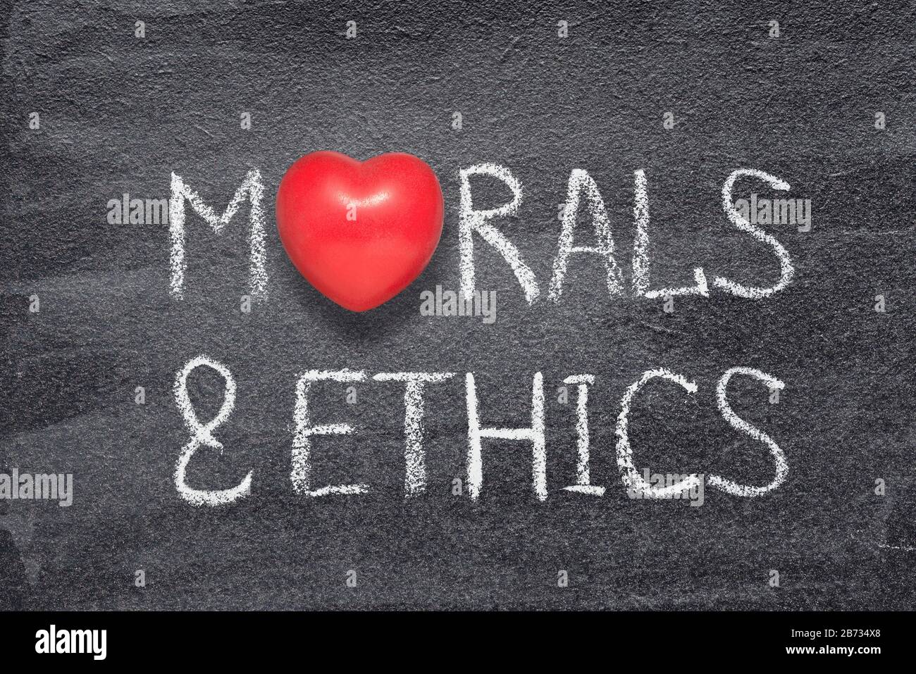 morals and ethics phrase written on chalkboard with red heart symbol instead of O Stock Photo