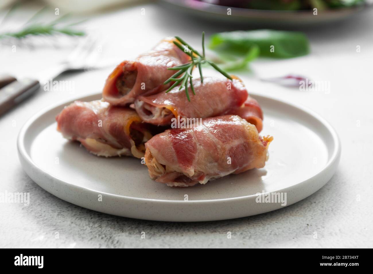 Delicious pigs in blankets, meat wrapped in bacon, homemade cooked meat