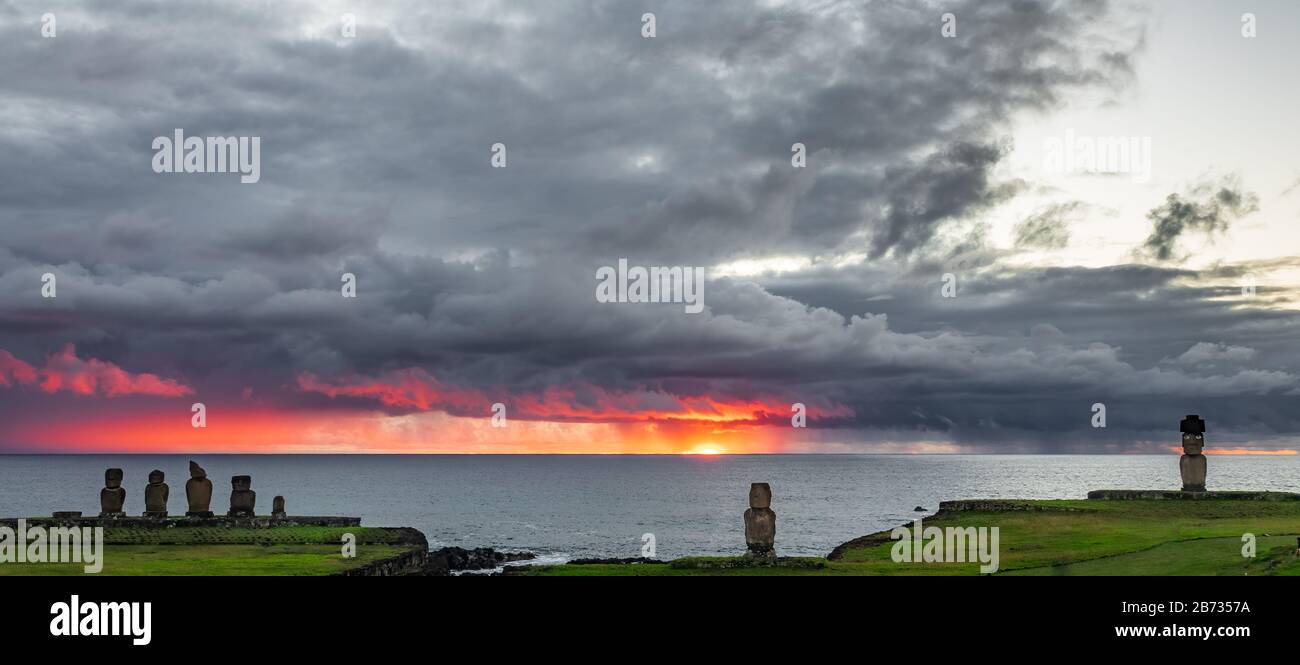 Tahai moais under stormy clouds at sunset Stock Photo