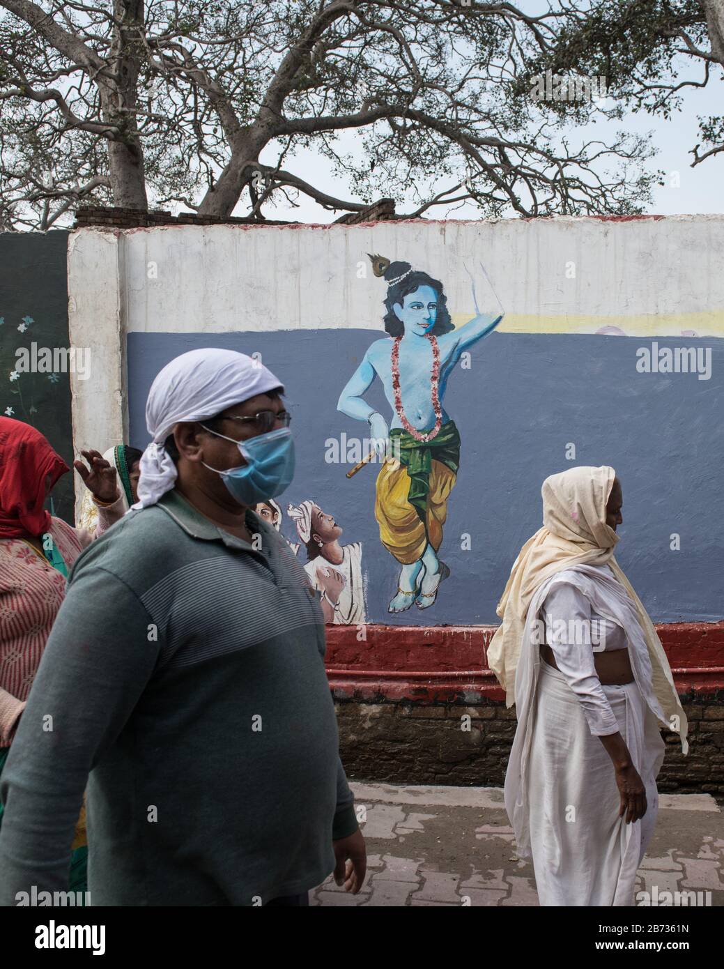 Vrindivan, Uttar Pradesh, India: Man wearing face mask during a procession as a preventive against the spread of the COVID-19 coronavirus outbreak. Stock Photo