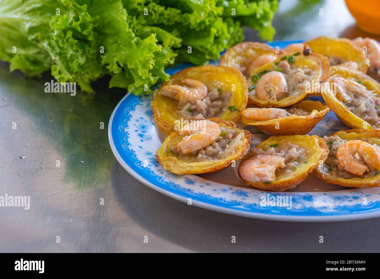 Banh Khot Vietnamese tiny shrimp pancake served with vegetables Stock