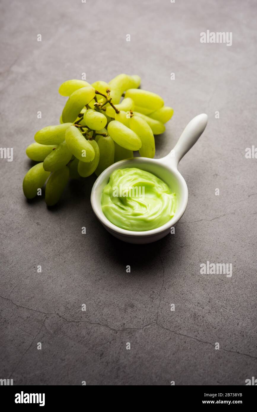 Green grapes, yogurt and honey mix face mask or cream for skin dark spot removal treatment, created using Angoor extract, curd and honey. selective fo Stock Photo