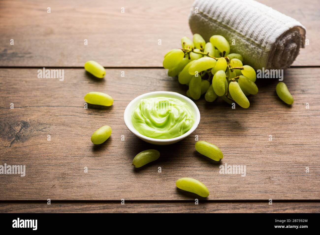 Green grapes, yogurt and honey mix face mask or cream for skin dark spot removal treatment, created using Angoor extract, curd and honey. selective fo Stock Photo
