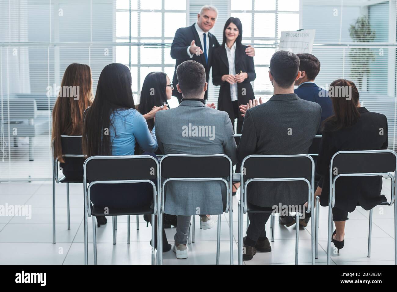 boss representing a young specialist during a work meeting. Stock Photo