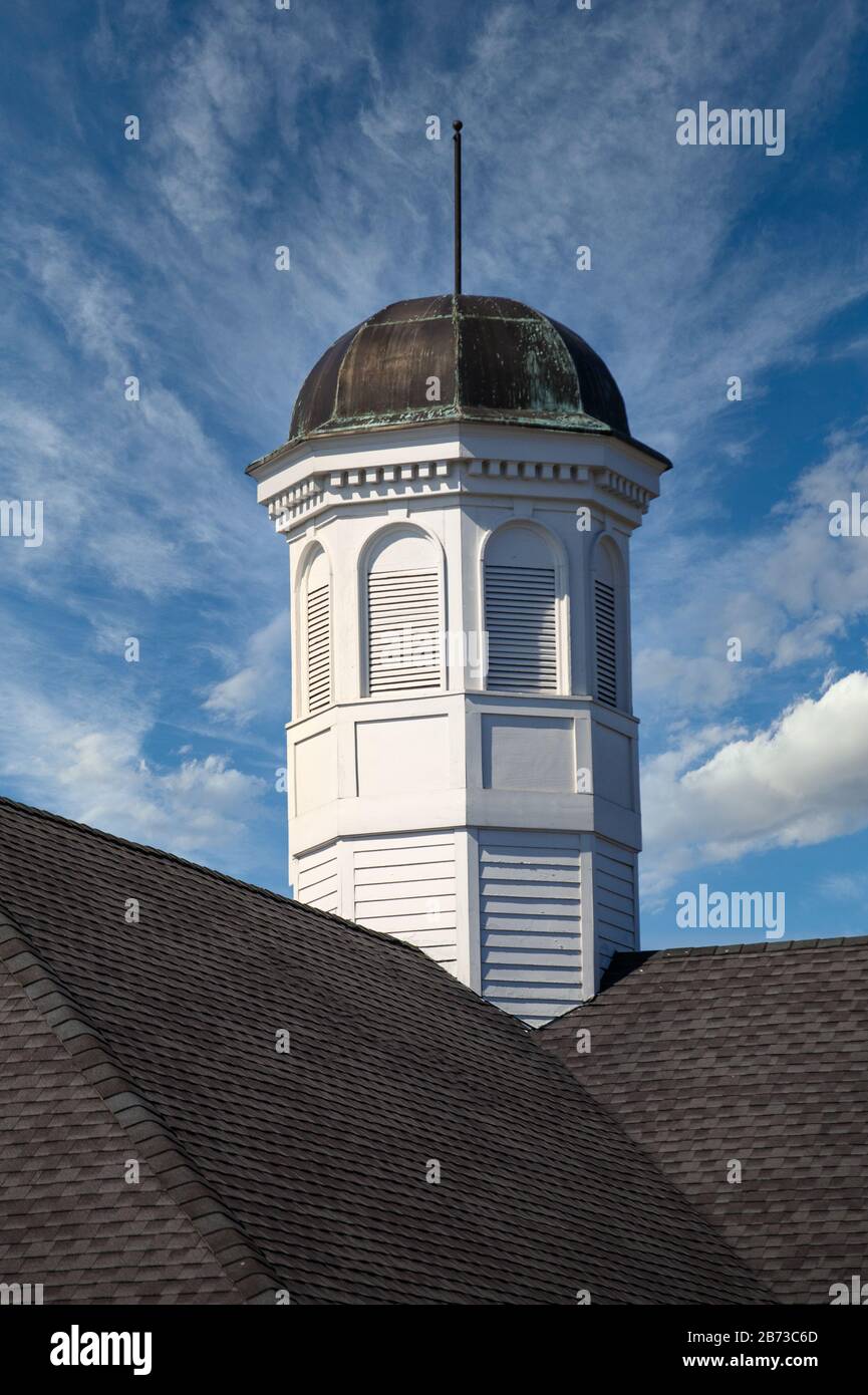 Tarnished Cupola on Roof Under Blue Skies Stock Photo