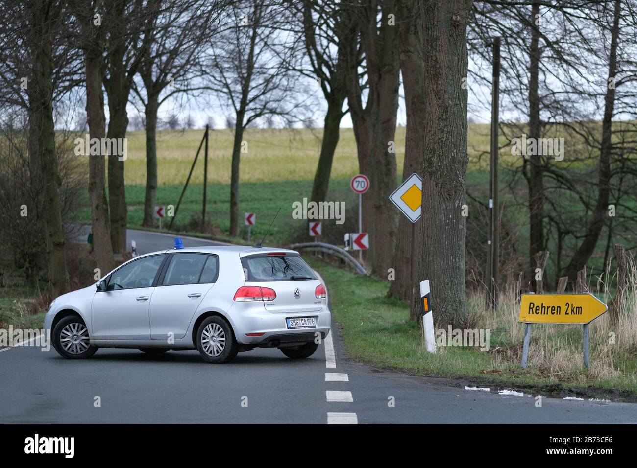 Auetal, Germany. 13th Mar, 2020. A police car blocks the access road to the farm in Auetal. On a farm in Auetal (district Schaumburg) the resident has barricaded himself because the veterinary office wants to check his animals. Credit: Peter Steffen/dpa/Alamy Live News Stock Photo