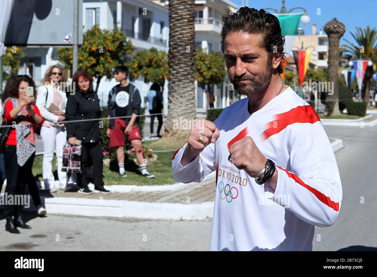 Sparta, Greece. 13th Mar, 2020. Actor JERARD BUTLER in the Olympic Torch relay on March 13, carrying the Olympic Flame from the Byzantine town of Mystras to Sparta for the 2020 Olympic Games in Tokyo. (Credit Image: © Aristidis VafeiadakisZUMA Wire) Stock Photo
