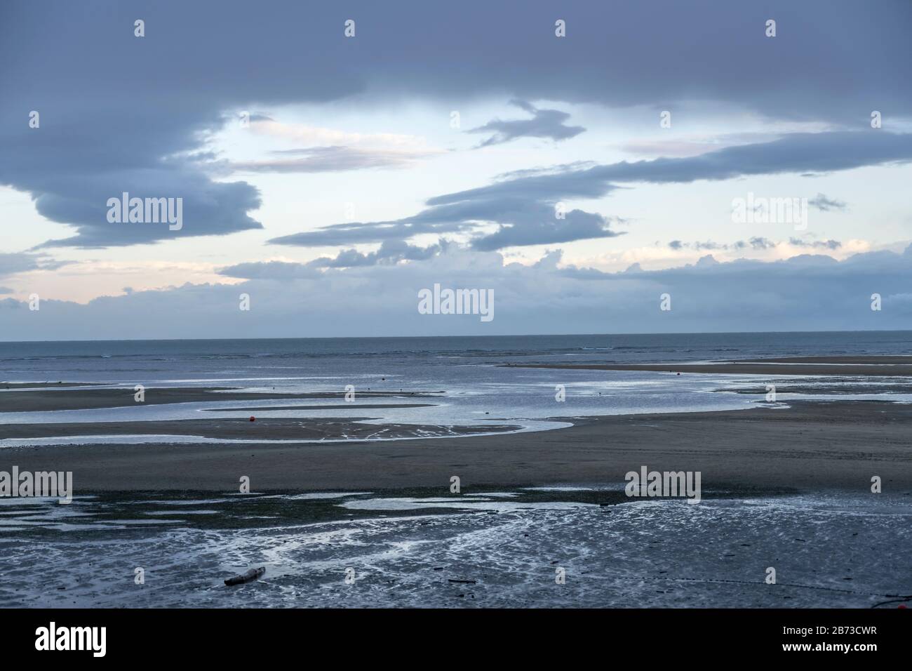 landscape with sand beach at low tide time at Sandy Bay , shot in cloudy twilight spring light at Marahau, Nelson, South Island, New Zealand Stock Photo