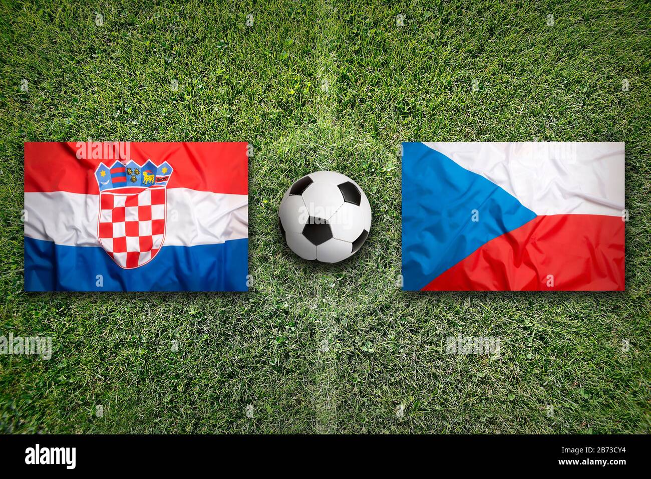 Croatia vs. Czech Republic flags on green soccer field Stock Photo