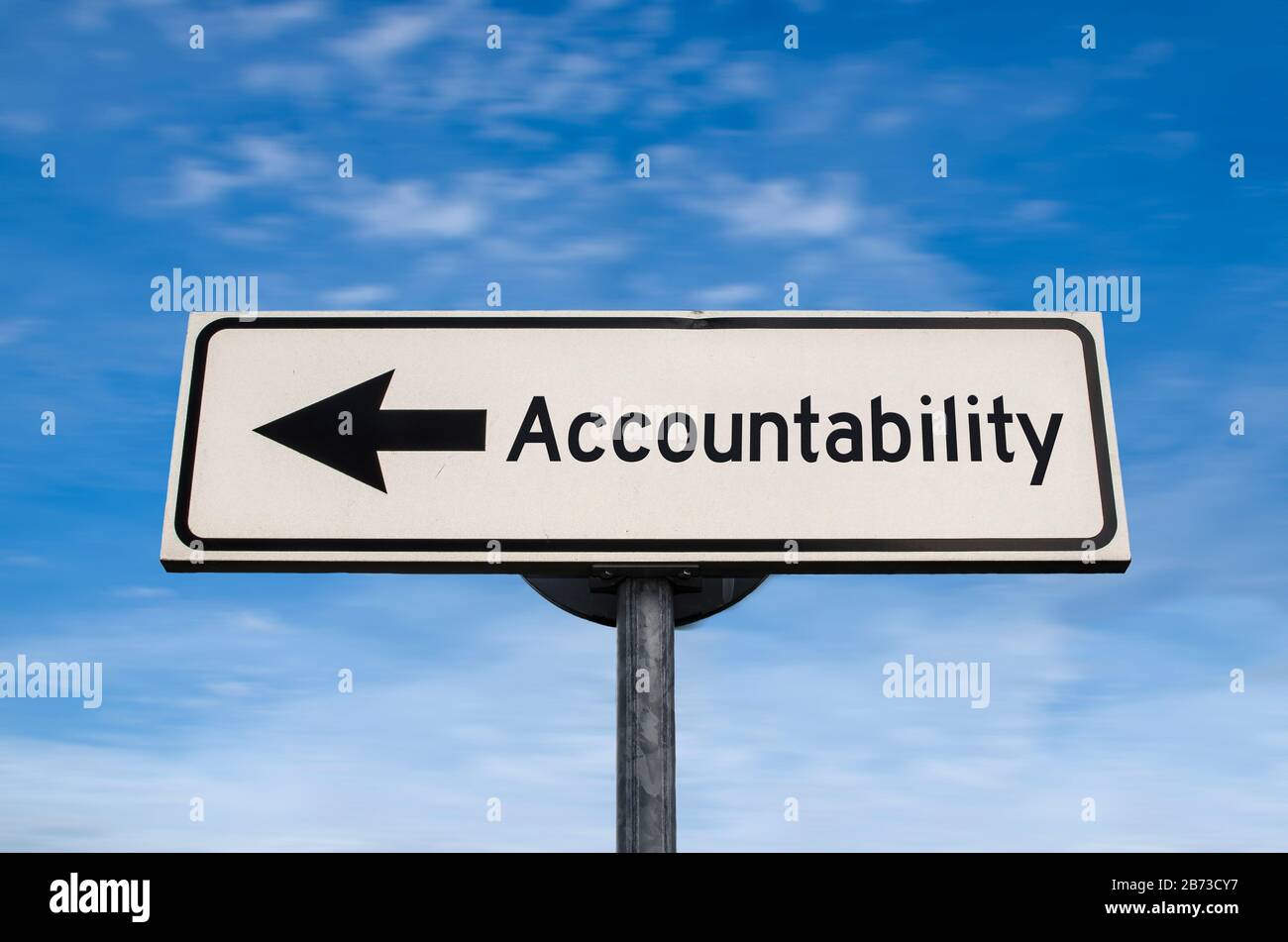 Accountability road sign, arrow on blue sky background. One way blank road sign with copy space. Arrow on a pole pointing in one direction. Stock Photo