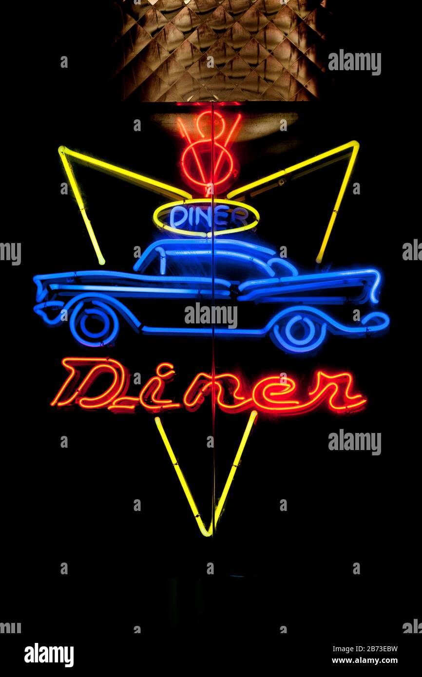 Close-up on a neon light shaped into 'Diner' neon sign. Stock Photo
