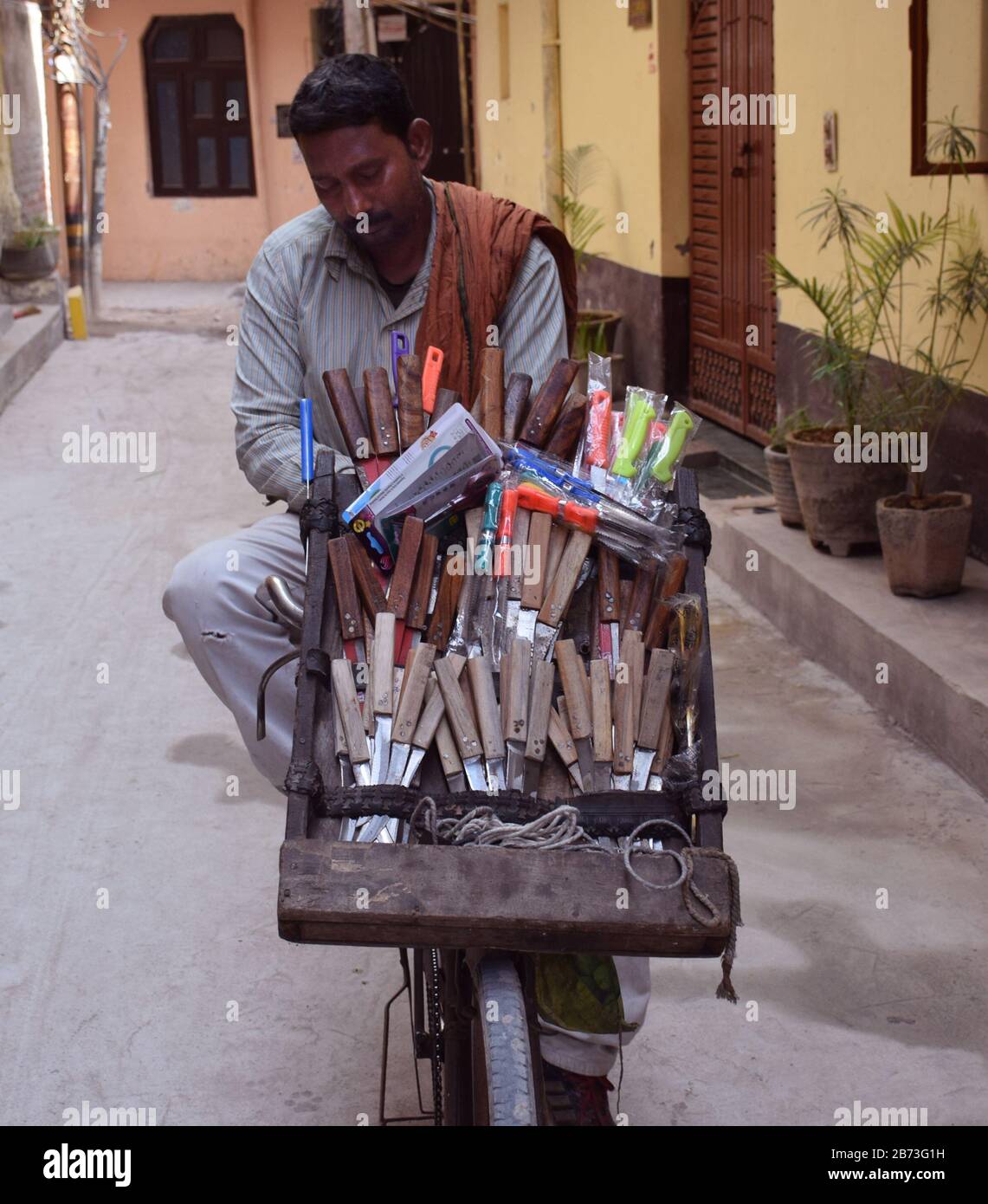 Front shot of a knife vendor selling knives in India Stock Photo Alamy