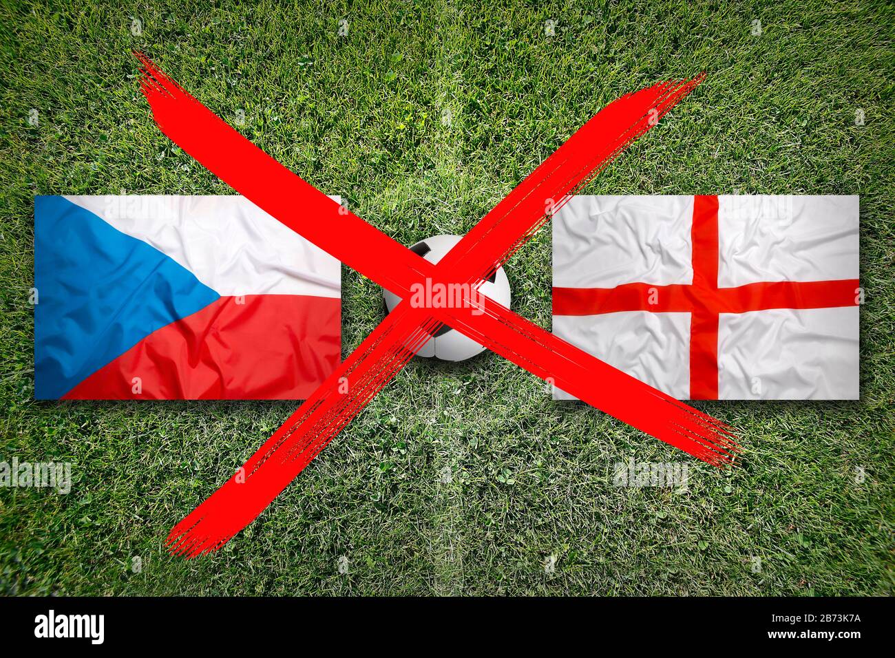 Canceled soccer game, Czech Republic vs. England flags on green soccer field Stock Photo
