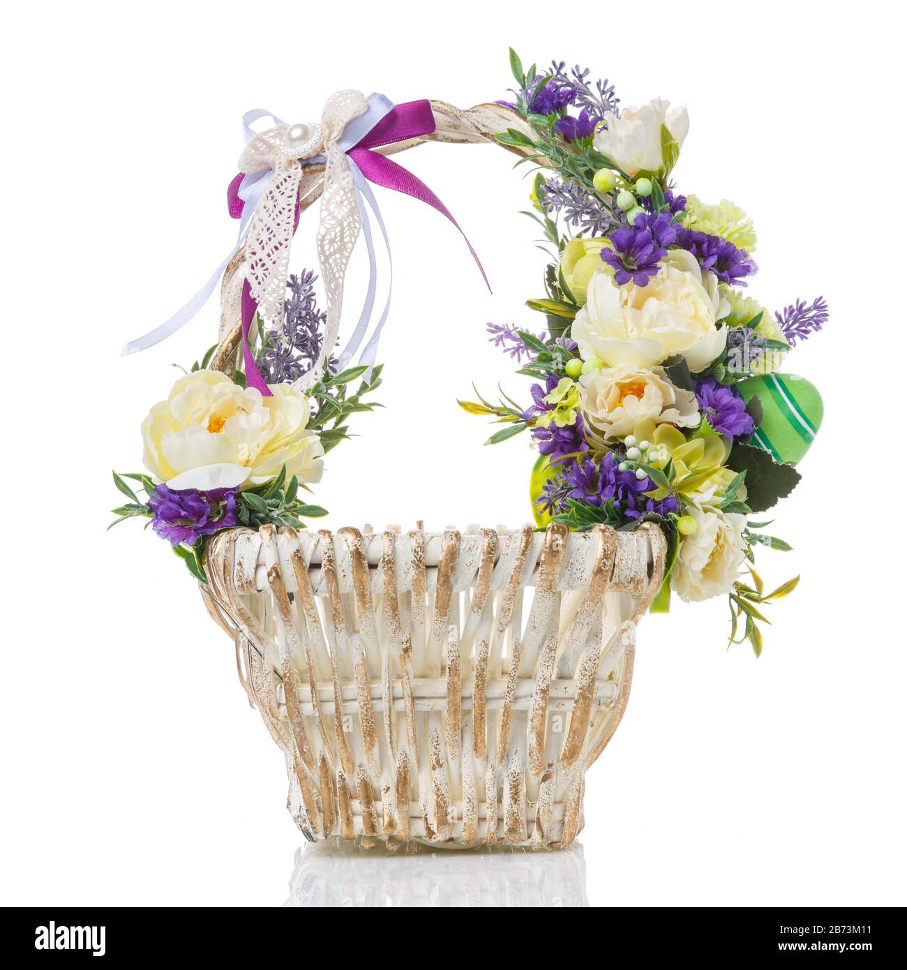 Wicker basket decorated with flowers on white background Stock Photo ...