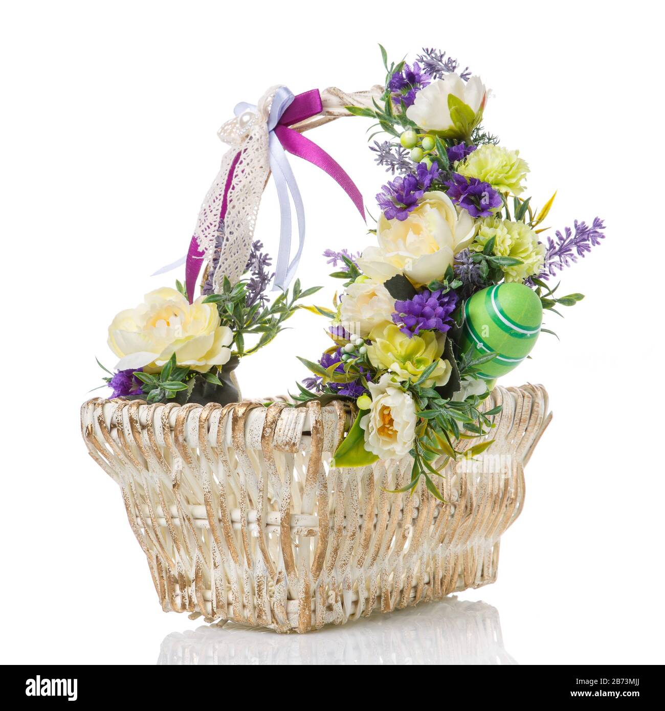 Easter basket decorated with light flowers, lavender and colored ...