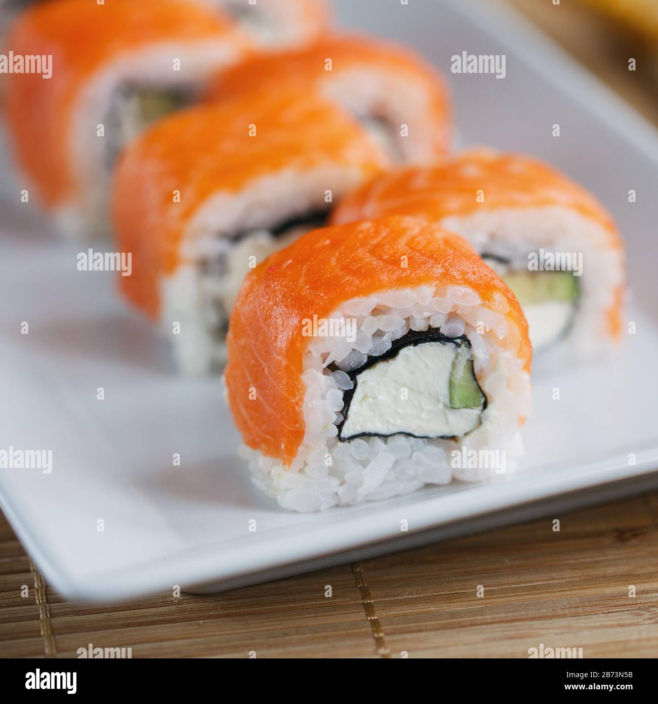 Sushi roll with salmon, avocado and cheese. Sushi menu. Japanese food