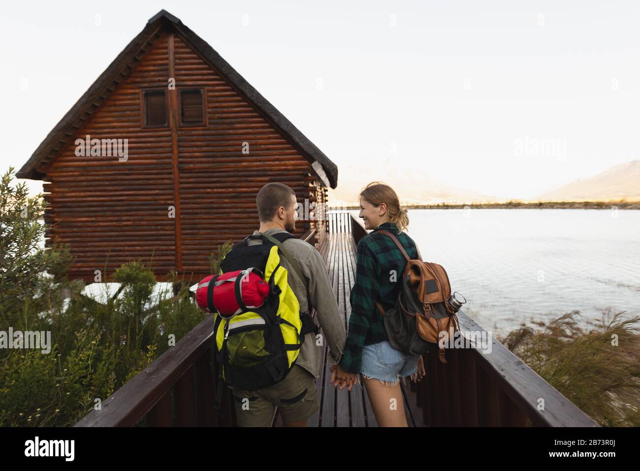 Back view couple holding hands hires stock photography and images Alamy