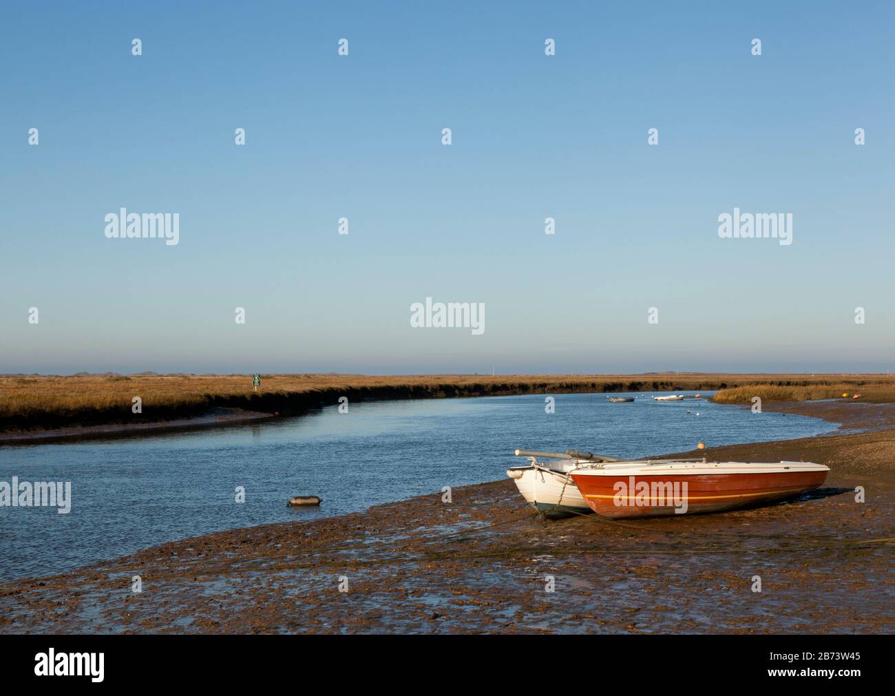 Boats moored at low tide Stock Photo